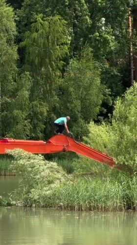 Dredging operation and quiet lakeside life in Bykovo, Russia