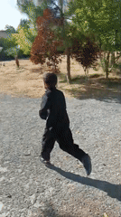 Child plays with balls in Pakistani village yards