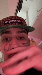 Tattooed man in Supreme cap filmed in Buenos Aires