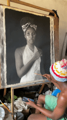 Artist creates charcoal portraits in Onitsha studio workspace
