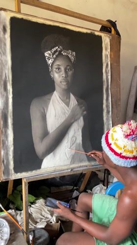 Artist creates charcoal portraits in Onitsha studio workspace