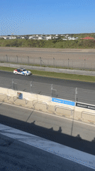 Race day at Zandvoort: cars, crews, and pit lane activity