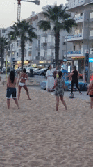 Outdoor beach fitness class in full swing on Quarteira's promenade