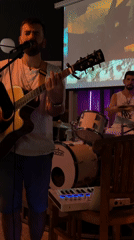 Acoustic guitar and vocals at a small Montenegro venue