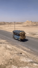 Heavy truck traffic observed on desert roads near Batezai