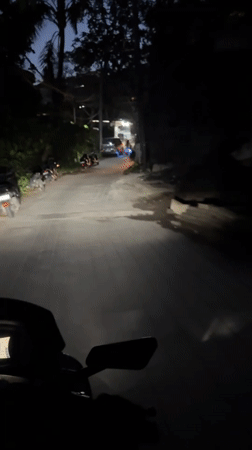 Evening motorcycle ride documented on Ubud road