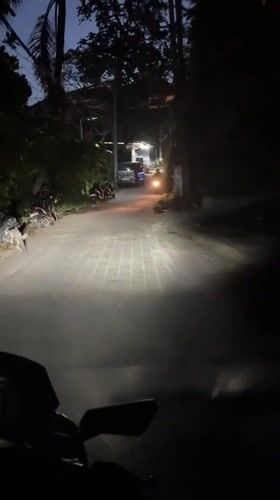Evening motorcycle ride documented on Ubud road