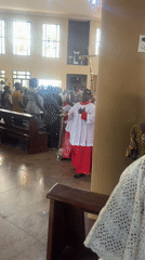 Religious procession with censer and cross observed in Abuja church