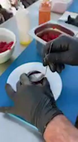 Chef prepares dish at outdoor event in Barbate, Spain