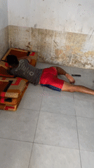 Person documented in casual indoor moments in Madiun home