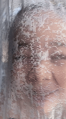 Person filmed behind sheer fabric in Russian village