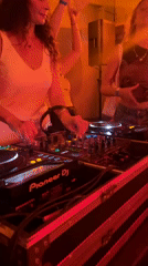 DJ performs at club in Midigama with dancing patrons