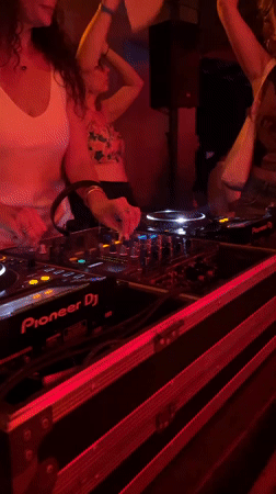 DJ performs at club in Midigama with dancing patrons