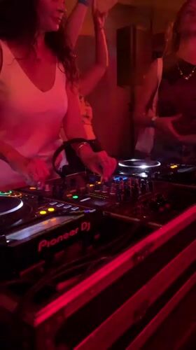 DJ performs at club in Midigama with dancing patrons