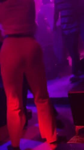 Nightclub patrons dance under disco lights in Guzape, Nigeria