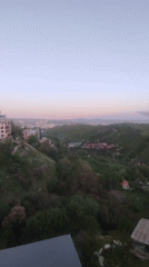 Dawn cityscape captured over green hills of Yerevan, Armenia