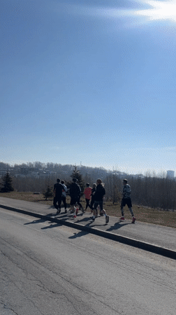 Morning joggers spotted on Kazan sidewalk during sunny weather