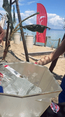Woman with vodka Red Bull bucket at Greek beach bar