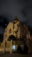 Ornate domed building filmed at night in Da Lat