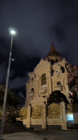 Ornate domed building filmed at night in Da Lat