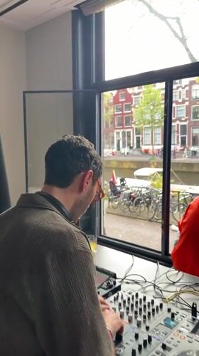 DJ performs at indoor venue in Amsterdam