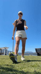 Woman dances in Fethiye park with Minnie Mouse pinwheel