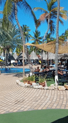 Resort guests enjoy poolside activities in Porlamar, Venezuela