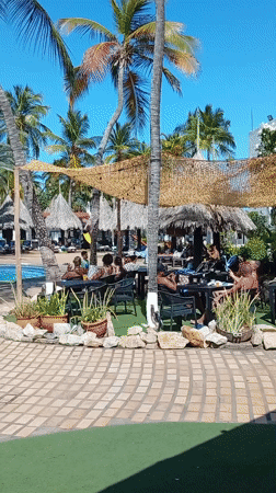Resort guests enjoy poolside activities in Porlamar, Venezuela