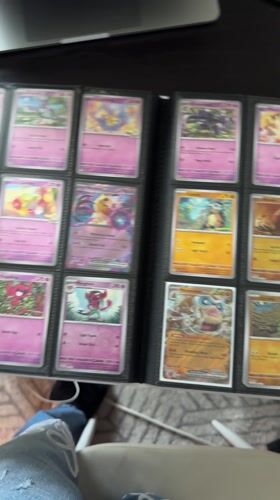 Pokémon card collector organizes binder in Milan