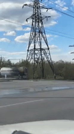 Electrical transmission tower filmed from vehicle in Kharkiv
