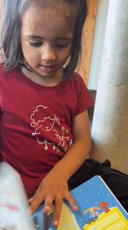 Quiet morning in La Fouillouse: books, coloring, and a parked car