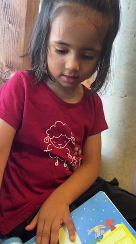Quiet morning in La Fouillouse: books, coloring, and a parked car