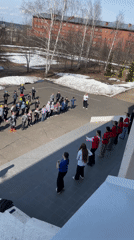 Children's outdoor dance activity documented in Sarapul schoolyard