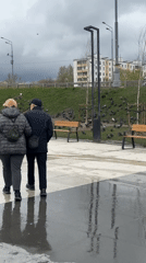 Rainy day street scenes documented across Moscow