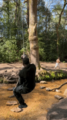 Man enjoys rope swing in Poole woodland area