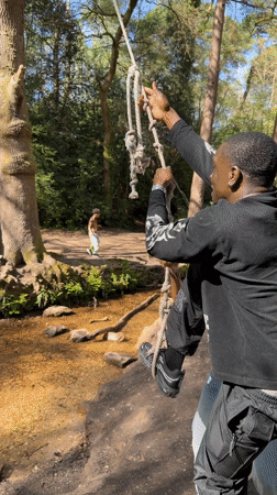 Man enjoys rope swing in Poole woodland area