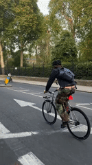 Cyclist in camo pants spotted riding through central London
