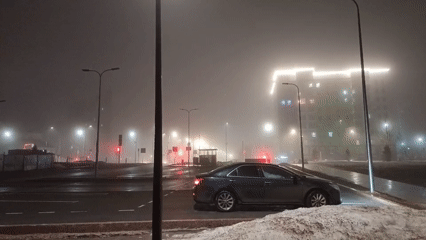 Foggy evening captured in Nizhnevartovsk with child playing on statues