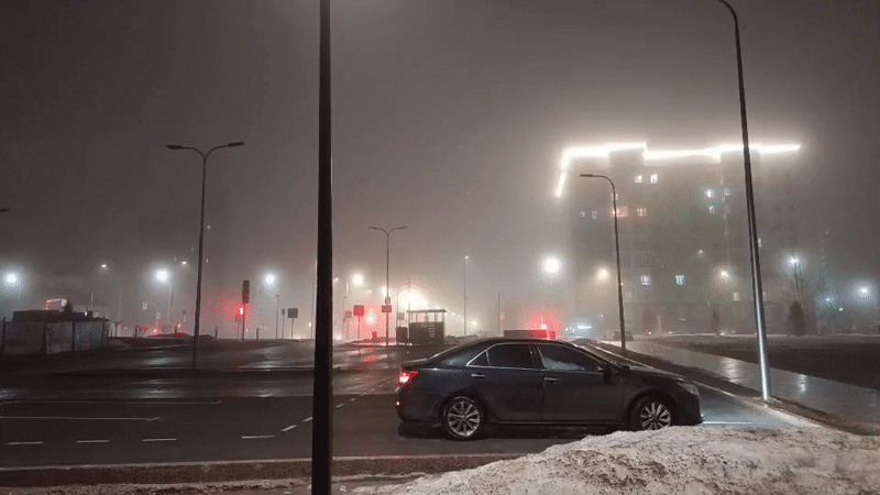 Foggy evening captured in Nizhnevartovsk with child playing on statues