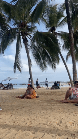 Afternoon beach life on the shores of Porlamar, Venezuela