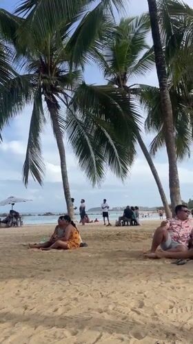 Afternoon beach life on the shores of Porlamar, Venezuela
