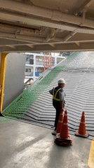 Ferry workers in safety gear observed near cargo bay
