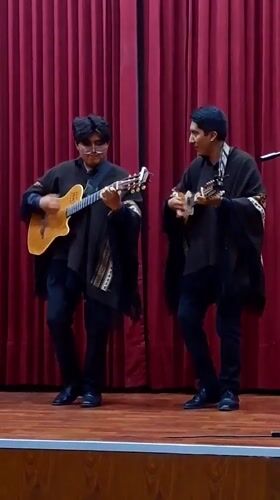 Musicians perform acoustic set on stage in Arequipa