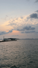 Sunset seascape captured from Pattaya with boats and skyline