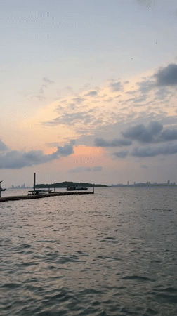 Sunset seascape captured from Pattaya with boats and skyline