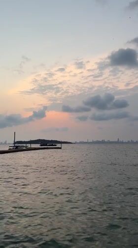 Sunset seascape captured from Pattaya with boats and skyline