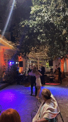 Live band and dancing under string lights in Castel Gandolfo