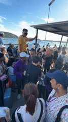 Tourist crowds queue for ferry boats at Nusa Penida terminals