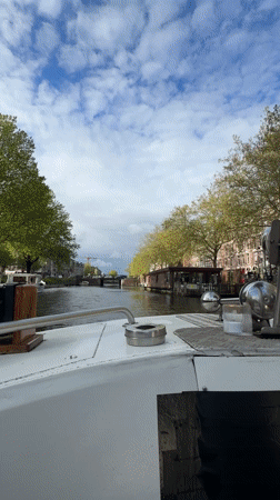 Leisurely canal boat tour documented across Amsterdam waterways