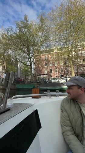 Leisurely canal boat tour documented across Amsterdam waterways